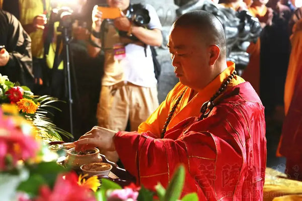 Shi Yongxin, then abbot of the Shaolin Temple, performing a ceremony in ceremonial robes